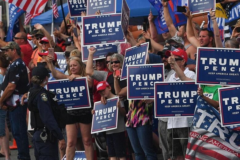 Supporters waiting for President Donald Trump during his recent visit to a medical products facility in Guilford, Maine. Those attending his upcoming election rally must sign a waiver on his campaign website agreeing not to sue if they catch Covid-19