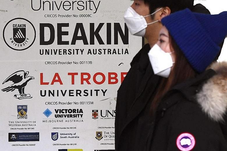 Signage in Melbourne for Australian universities. International students may soon be let back into the country. PHOTO: AGENCE FRANCE-PRESSE