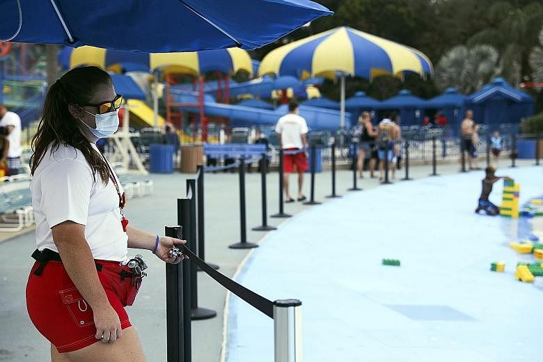 A lifeguard at the Legoland theme park in Winter Haven, Florida, last week. Legoland was the first big theme park in the state to reopen after the lockdown. But in the past week, new cases rose in Florida, along with Arkansas, South Carolina and Nort