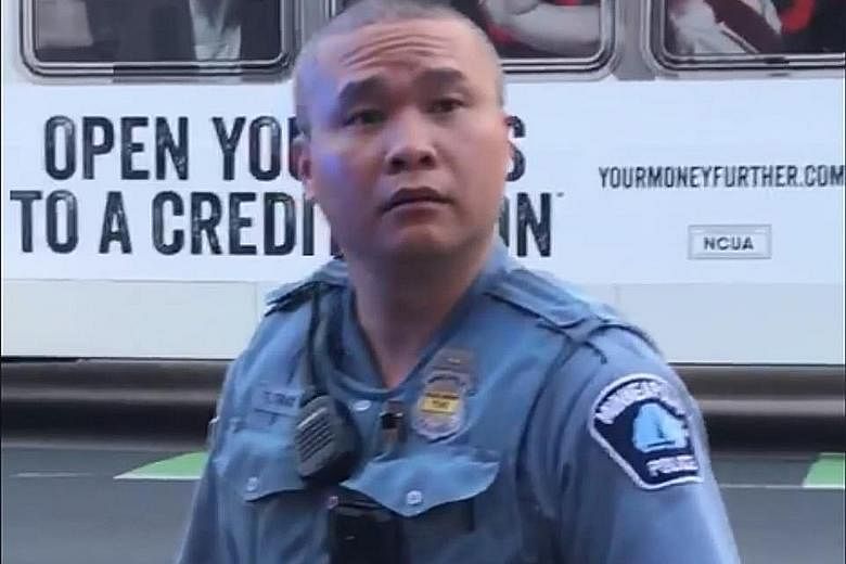 The sight of Tou Thao, a Hmong American, backing the white police officer who killed Mr George Floyd has led to soul-searching among Asian Americans. PHOTO: DARNELLA FRAZIER / FACEBOOK
