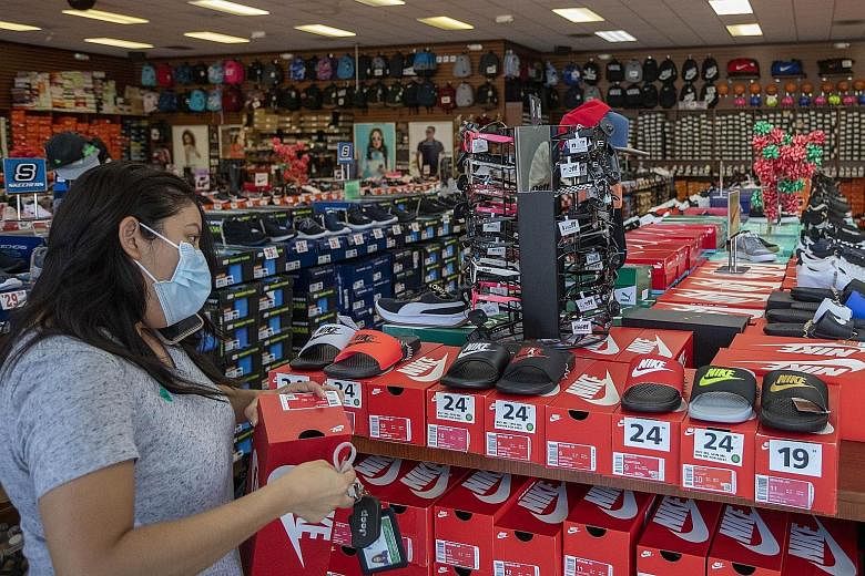 A shopper at a store in California last month, after stores were allowed to reopen with restrictions. Whether people see unexpected savings built up during coronavirus lockdowns as a windfall or a buffer against future uncertainties is likely to dete