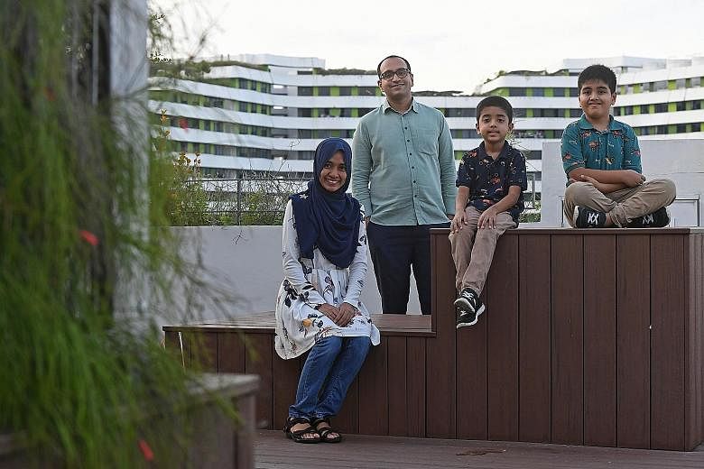 Mr Mohamed Sirajudin Mohamed Salman (with his wife Nadleen Mohamed Shariff) finds teachable moments to guide his sons, Mohamed Husain Mohamed Sirajudin (far right), seven, and Mohamed Hasan Mohamed Sirajudin, six, to embrace different cultures.