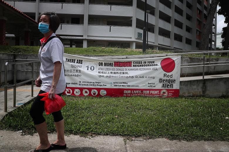 A dengue alert banner in Ang Mo Kio earlier this month. Over 10,700 people have been infected with dengue this year, and at least 12 have died. ST PHOTO: KELVIN CHNG