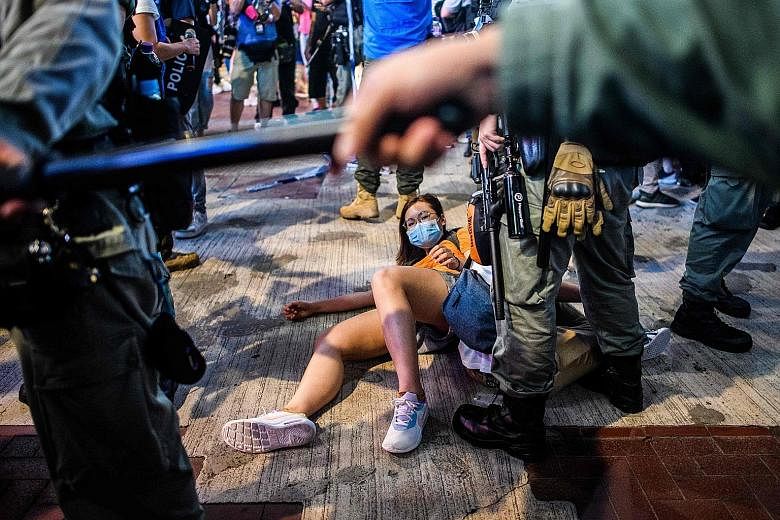 After thousands of Hong Kongers gathered in various places including malls to chant pro-democracy slogans on Friday, police said they arrested 28 men and 15 women for offences that included unlawful assembly, disorderly conduct in a public place and 