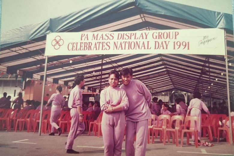 Mr Clarence Chan (right), with a fellow participant from the People's Association at the former PA headquarters opposite the old National Stadium in Kallang, during rehearsals for NDP 1991.