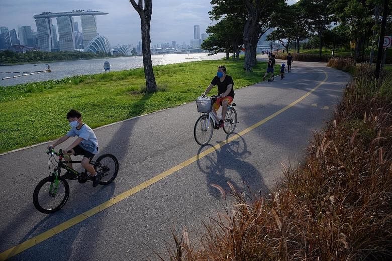Cyclists at Gardens by the Bay East. Research has shown that regular exercise not only keeps your mood up, but the benefit also persists for weeks even after stopping exercise.