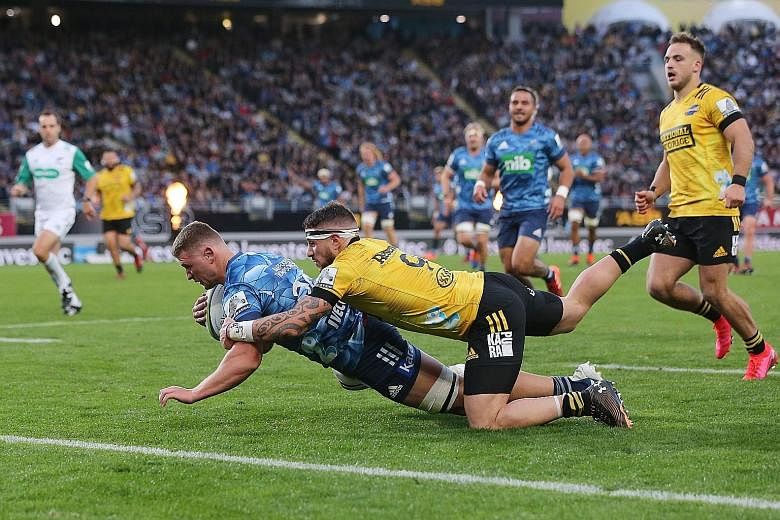 Blues' Dalton Papalii diving for a try during the Super Rugby Aotearoa match against the Wellington Hurricanes at a sold-out Eden Park yesterday.