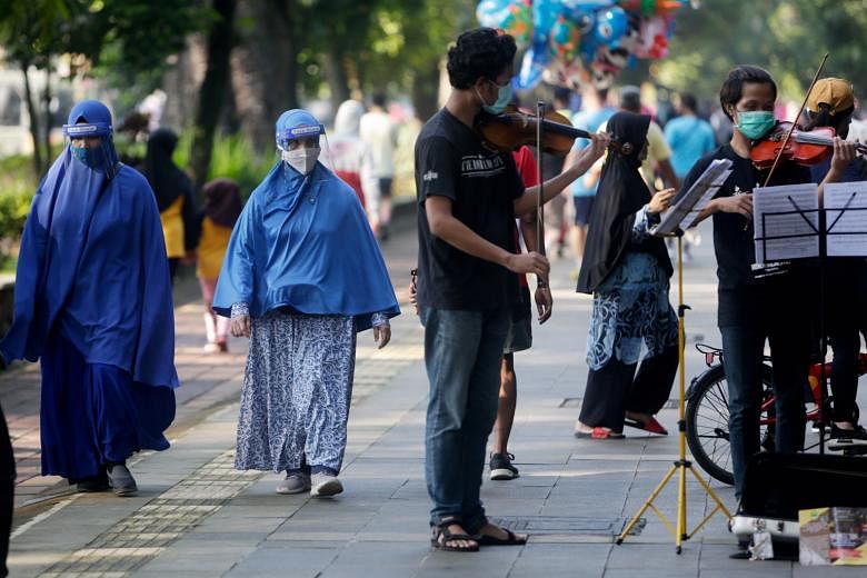 Experts are concerned that the relaxation of social curbs in many parts of Indonesia, including Bogor (above), will drive up the virus infection rate. Workplaces, places of worship, shopping centres and recreational venues started reopening gradually