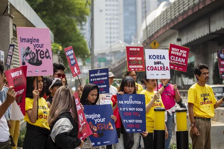 Demonstrators at a "Korea Not Coalrea" rally in front of the South Korean Embassy in Jakarta last October, calling on South Korean financiers not to support a coal-fired power plant expansion project in Cilegon in Indonesia's Banten province. PHOTO: 