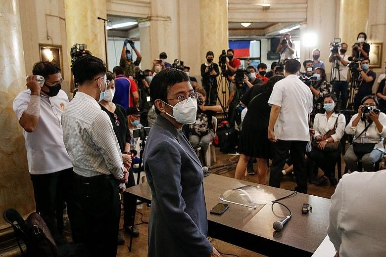Philippine journalist Maria Ressa (centre) at a media conference after attending the court's verdict promulgation in Manila yesterday. PHOTO: EPA-EFE
