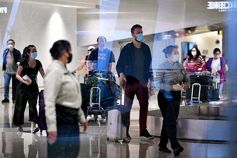 Passengers arriving at Changi Airport Terminal 1 last Friday. All travellers entering Singapore from 11.59pm on Wednesday will have to take a Covid-19 test before the end of their 14-day stay-home notice at a designated community testing facility. ST