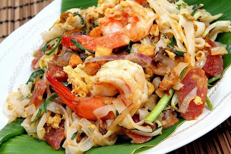 Recreate the yolkiness of Penang char kway teow by using extra-large eggs and adding an extra yolk.