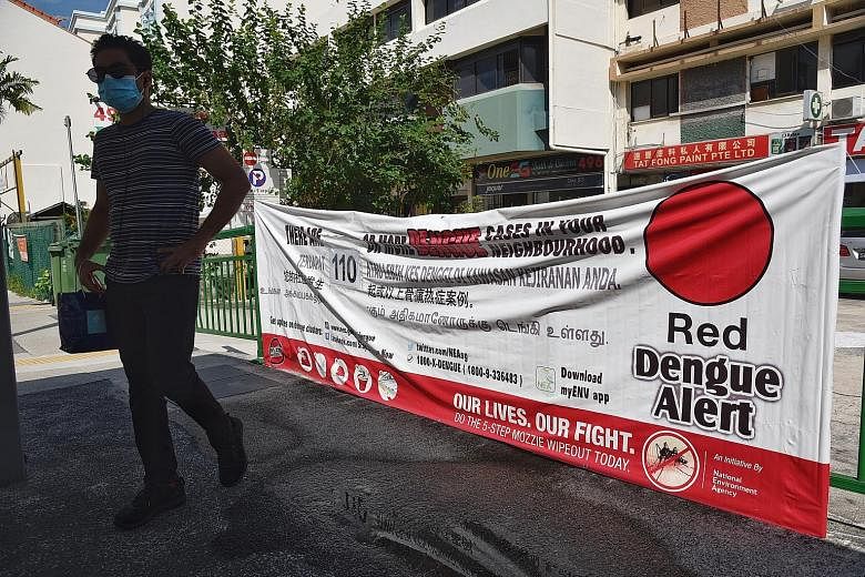 A dengue fever red alert cluster banner showing 110 cases along Geylang Road on Monday. During the April-May circuit breaker months, the NEA found five times the number of breeding sites in homes, and twice the usual number at construction sites. ST 