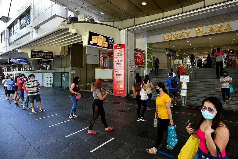 Domestic workers should not gather or loiter in public spaces or visit crowded areas such as City Plaza, Lucky Plaza and Peninsula Plaza, said the Manpower Ministry. ST PHOTO: LIM YAOHUI