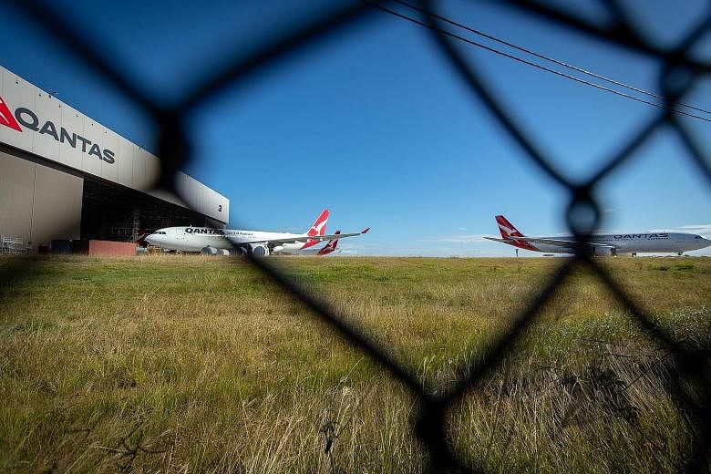 Grounded Qantas aircraft outside a hangar at Brisbane Airport on June 9. Australia has been largely successful in containing the spread of the novel coronavirus, which it attributes to curbs on international travel and tough social-distancing rules. 