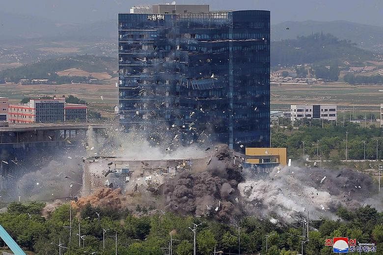 The blast that destroyed the inter-Korean liaison office in the border city of Kaesong on the North's side of the demilitarised zone on Tuesday, in this picture supplied by the Korean Central News Agency. The South's military warned that the North wi