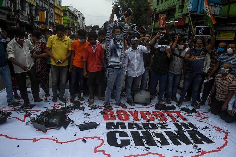 Congress party supporters demanding a boycott of Chinese goods at an anti-China demonstration in Kolkata yesterday. China is India's largest trading partner, with trade reaching $129 billion last year. PHOTO: AGENCE FRANCE-PRESSE