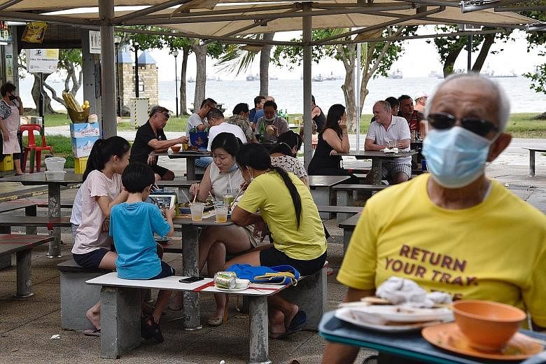 Customers dining in at the East Coast Lagoon Food Village yesterday. Compassion and care for the environment and those around us should be what spurs people to be more hygienic when eating out, says Minister for the Environment and Water Resources Ma