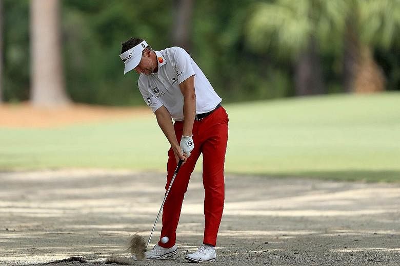 Ian Poulter of England playing his second shot on the 15th hole during the first round of the RBC Heritage in Hilton Head Island, South Carolina. He was even on the par-five hole en route to a 64.