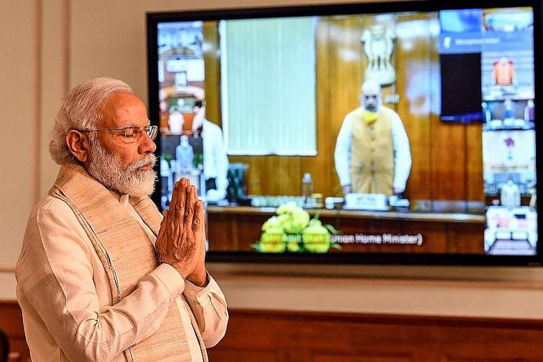 A photo released by the Indian Press Information Bureau showing Prime Minister Narendra Modi in a two-minute silent tribute on Wednesday to the soldiers who died during a clash with Chinese troops on Monday. PHOTO: AGENCE FRANCE-PRESSE