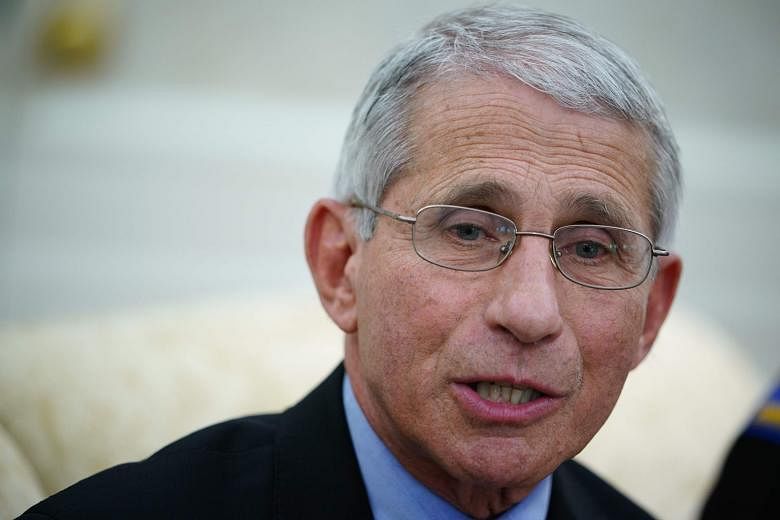 Dr Anthony Fauci (above) says it is a mixed bag when it comes to the public's acceptance of advice to wear masks. Some, like casinos in Las Vegas (left), have accepted recommendations to mask up while others choose to ignore it. PHOTO: AGENCE FRANCE-