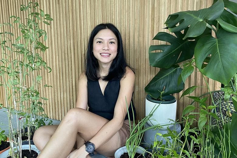 Community in Bloom ambassador Iris Ho grows vegetables and fruit such as Chinese spinach and cucumber along the corridor of her Ang Mo Kio Housing Board flat, while Ms Loh Lay Kwan (above), vice-president for sustainable operations at DBS Bank, has a toma