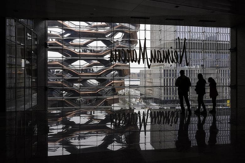 The 11ha Hudson Yards (above and left) in Manhattan has helped define the live-work-play ethos that many younger professionals seek in cities. But such mixed-use malls have suffered from measures imposed to curb the coronavirus pandemic PHOTOS: NYTIM