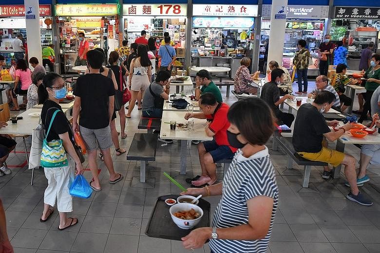 As some queue at their favourite stalls at Tiong Bahru Market hawker centre, others eagerly tuck into their breakfast after so many weeks of not being able to have meals at eateries. People queueing at the Din Tai Fung restaurant at Jem shopping mall