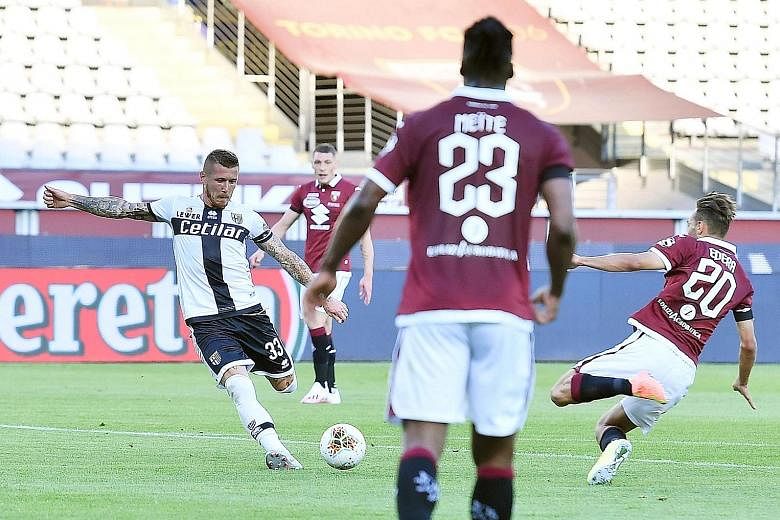 Parma's Juraj Kucka scoring the goal that earned his side a 1-1 draw against Torino in the Serie A on Saturday. The match in Turin was the first in the Italian top flight in 103 days. In the later game, 10-man Verona held on to beat Cagliari 2-1. Both fix