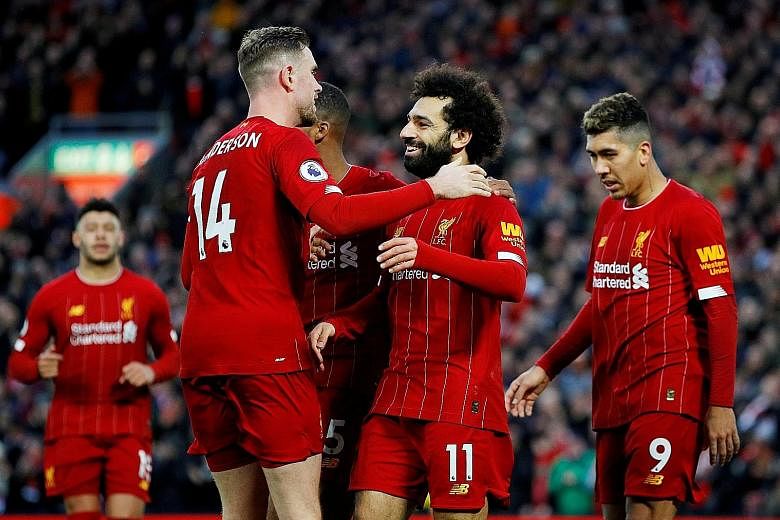 Liverpool’s Mohamed Salah (above, centre) celebrates with teammates after scoring a goal against Southampton on Feb 1.