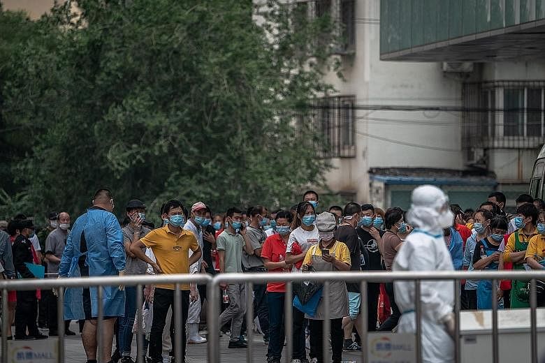 People waiting to be tested for Covid-19 in Beijing yesterday. In a bid to assuage public concerns amid a recent outbreak in the city, China has ordered an increasing number of people in the capital city to undergo tests for the coronavirus.