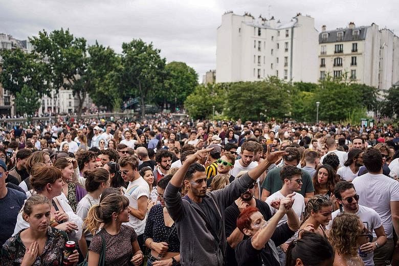People dancing at the French midsummer Festival of Music at the Villemin garden in Paris on Sunday. But many who watched the crowds on the streets were horrified, taking to social media to voice fears of a second wave of coronavirus infections and cr