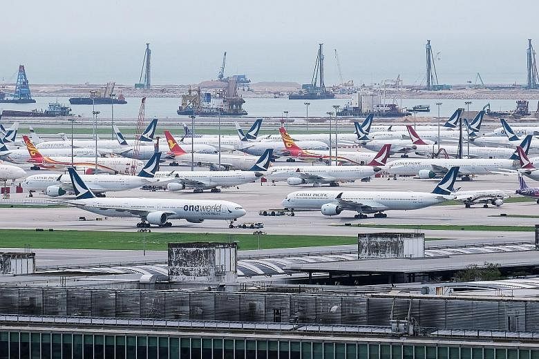 Cathay Pacific and Cathay Dragon aircraft at Hong Kong International Airport earlier this month. Mr Subhas Menon, chief of the Association of Asia Pacific Airlines, says allowing airlines to fly and to open up routes progressively will lead to benefi