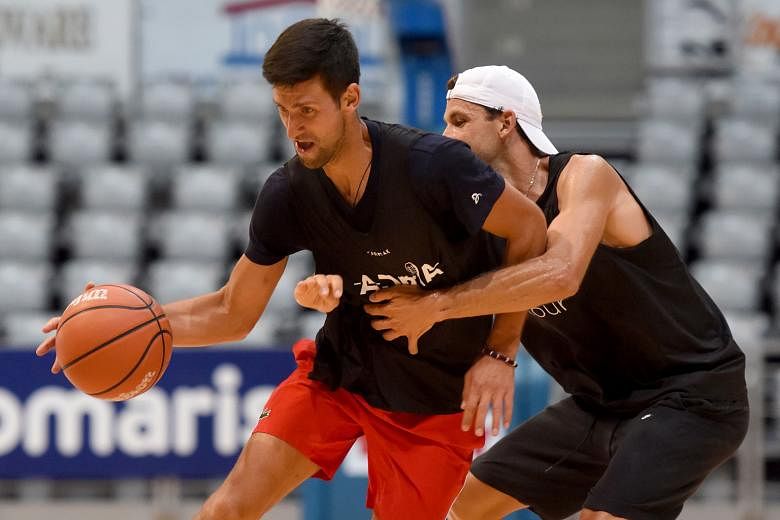 Serbia's Novak Djokovic and Bulgarian Grigor Dimitrov playing in an exhibition basketball game in Zadar, Croatia, during a break in the Adria Tour tennis event. PHOTO: AGENCE FRANCE-PRESSE