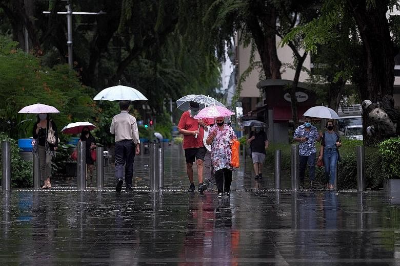 Pedestrians in Orchard Road walking in the rain yesterday morning. Among the areas hit by flash floods, the heaviest rainfall of 108.8mm was recorded in Bedok South.