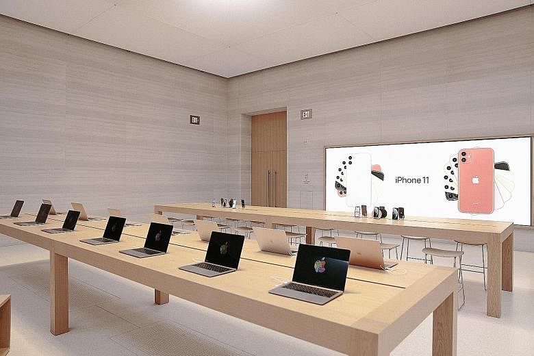 Apple laptops inside the company's Fifth Avenue store in New York. The company moving to use its own chips in Macs ends a nearly 15-year reliance on Intel Corp to supply processors for its flagship laptops and desktop.