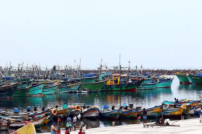 Boats bobbing quietly on the waters around Chennai as fishing has been banned for almost three months in Tamil Nadu to prevent overcrowding at fish markets. With nothing to do, many fisherfolk are spending their time painting their boats or repairing