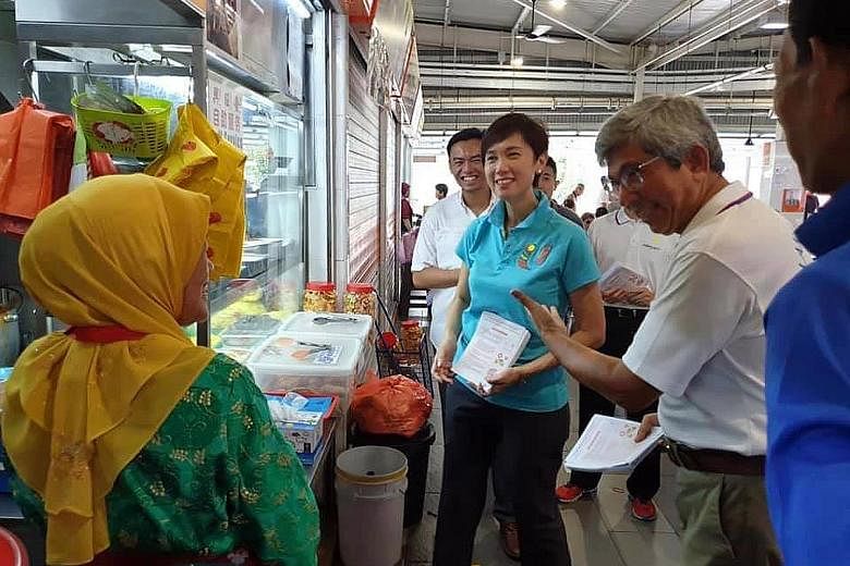 Dr Yaacob Ibrahim introducing Manpower Minister Josephine Teo and potential candidate and polytechnic senior lecturer Wan Rizal Wan Zakariah - both expected to contest in Jalan Besar GRC - to residents at a Geylang Bahru market in Kolam Ayer ward of 