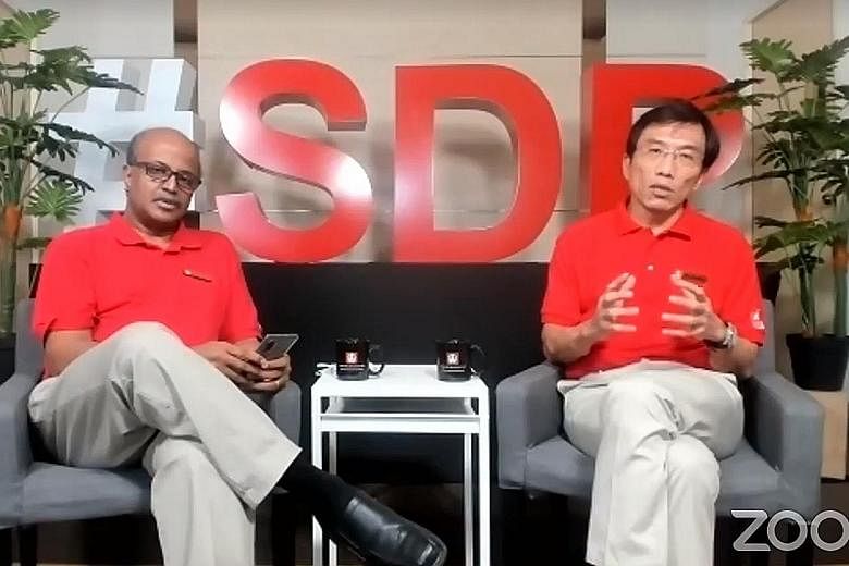 Singapore Democratic Party chairman Paul Tambyah and secretary-general Chee Soon Juan in an online session with the media yesterday. Dr Chee said the meeting was to talk about issues that affect Singaporeans "front and centre".