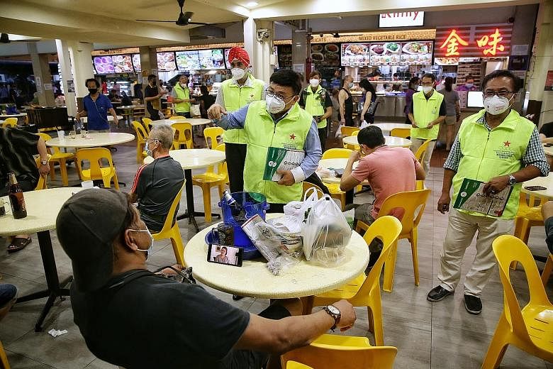 Singapore Democratic Alliance president Desmond Lim, with party member and potential candidate Harminder Pal Singh, on a walkabout at a coffee shop in Pasir Ris on Monday. ST PHOTO: KEVIN LIM Home Affairs and Law Minister K. Shanmugam, an outgoing MP