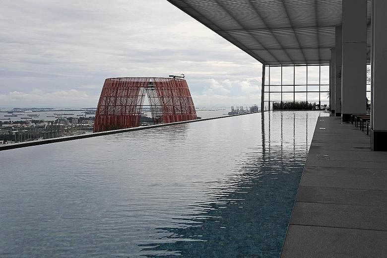 At high-rise development Wallich Residence in Tanjong Pagar, a library for residents is located on the 52nd floor while an infinity pool is on the 39th floor.