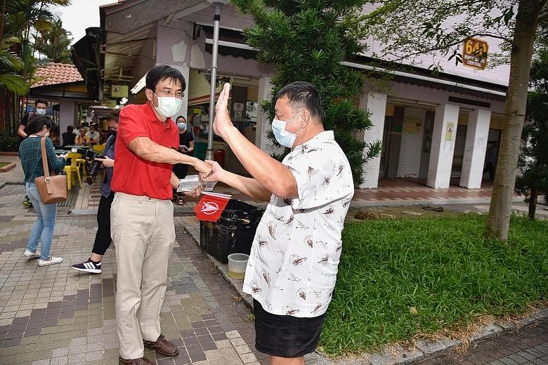 Singapore Democratic Party (SDP) chief Chee Soon Juan (left) greeting a resident during a walkabout in Bukit Batok Central yesterday. The opposition politician has confirmed that he will be contesting in the single-member constituency at the polls on