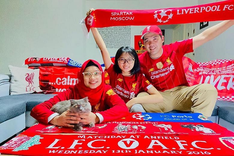 Liverpool fan Mohamed Ismail watched Chelsea take on Manchester City with his wife Fauzlin Sapri, 39, daughter Iffa Umairah, 14, and cat Seoul yesterday morning. City’s defeat marked Liverpool’s coronation, a moment that brought him as much joy as the bir