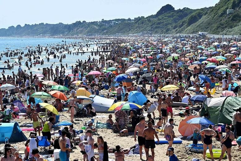 Bournemouth beach in England (above) was packed on Thursday as people celebrated the end of lockdown. Other beaches, including Southend in Essex (below), also drew large crowds - and official warning over the risks of Covid-19 infections.
