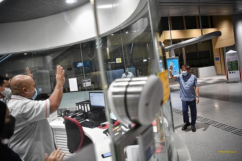 Mr Khaw Boon Wan, who has anchored Sembawang GRC for more than a decade, waving to SMRT staff at Canberra MRT station yesterday. ST PHOTO: ARIFFIN JAMAR
