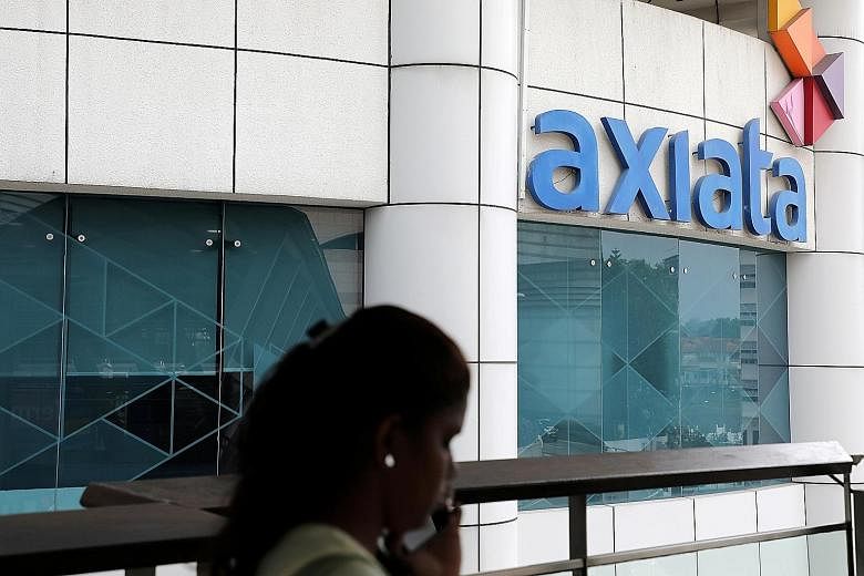 Axiata's headquarters in Kuala Lumpur. Great Eastern will get a 21.875 per cent stake in the venture, which will fund the expansion of Axiata Digital's financial services business over the next year in Malaysia and the region. 