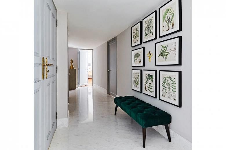 Botanical prints are paired with a green bench (above) at the entrance. The dining room overlooks the living room so family members can continue to interact even when they are in different spaces. 