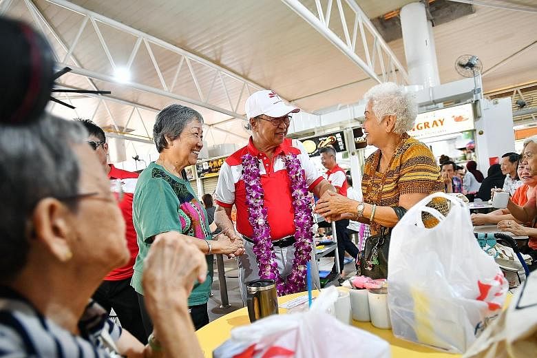 Dr Tan Cheng Bock of the Progress Singapore Party greeting West Coast GRC residents at a food centre in Teban Gardens Road on Jan 12. The former PAP MP, now the secretary-general of PSP, will be leading its A team to contest in the constituency, whic