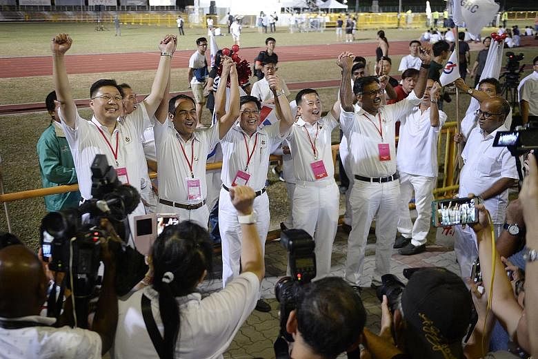 PAP Aljunied GRC candidates (from left) Chua Eng Leong, Shamsul Kamar, Yeo Guat Kwang, Victor Lye and Murali Pillai at Toa Payoh Stadium in 2015 before the results of the recount of votes were announced. They lost to the WP by a razor-thin margin. Al