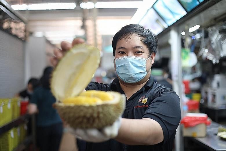 Mr Cedrick Shui, second-generation owner of Ah Seng Durian at Ghim Moh Market, says the Mao Shan Wang variety accounts for 80 per cent of sales. The shop sells about 500kg of durians a day.